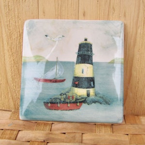 Ceramic light house 5 inch square tile - decorative tile -striped lighthouse, 2 boats, and bird with the ocean and islands backdrop