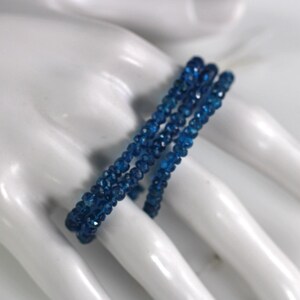 Blue apatite rondelles, faceted, 4mm, 1 strand of 187 beads.