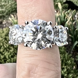 Certified 11.9TCW Three Stone Moissanite Surprise Halo Journey & Optional 3mm Eternity Ring