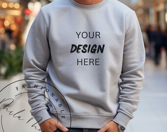 May include: A grey sweatshirt with the text "YOUR DESIGN HERE" printed on the front.