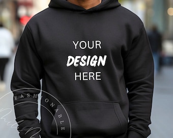 May include: A black hoodie with a white text overlay that says "YOUR DESIGN HERE".