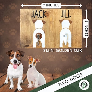Personalized dog leash holder featuring two painted Jack Russell terrier butts with metal hooks for tails. Shown next to a photo of two real Jack Russells for comparison. Handmade wood sign measures 9x6 inches. Custom painted to match your dogs’ breeds and colors. A unique and fun gift for dog lovers or pet parents. Perfect wall decor for leash and collar storage.