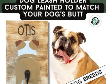 May include: Wooden dog leash holder with a painted dog butt design, personalised with the name "Otis." The text reads "DOG LEASH HOLDER CUSTOM PAINTED TO MATCH YOUR DOG'S BUTT." An English Bulldog is also pictured. The sign is for all dog breeds.