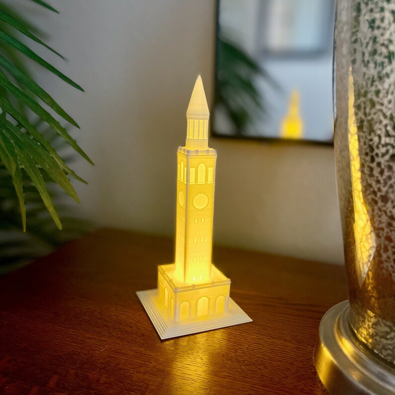 The UNC lighted cake topper, shown as part of a bedroom setting.