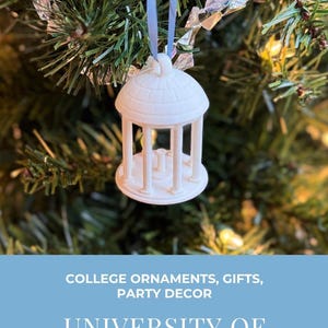 3D printed ornament of the UNC Old Well building, a detailed miniature replica, displayed as elegant UNC holiday décor.