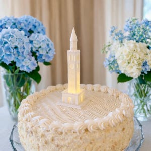 UNC bell tower figurine, show in use as a cake topper for UNC Chapel Hill grads.