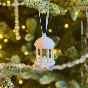 The smaller UNC Old Well ornament, shown on a Christmas tree.