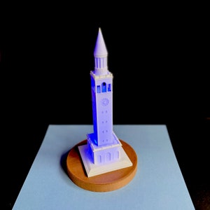 Side view of UNC Bell Tower LED light with detailed windows and clock faces