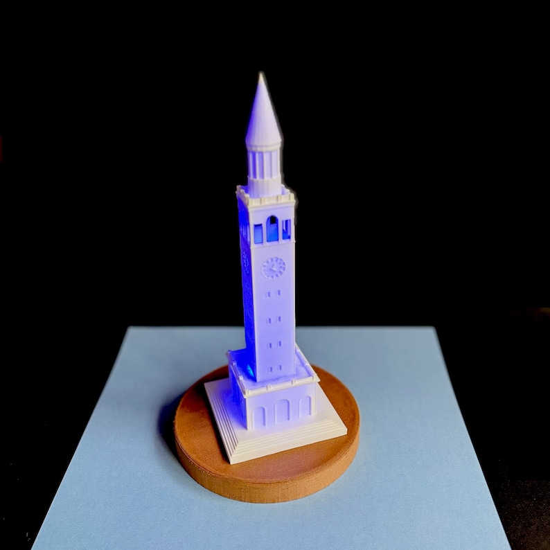 Side view of UNC Bell Tower LED light with detailed windows and clock faces