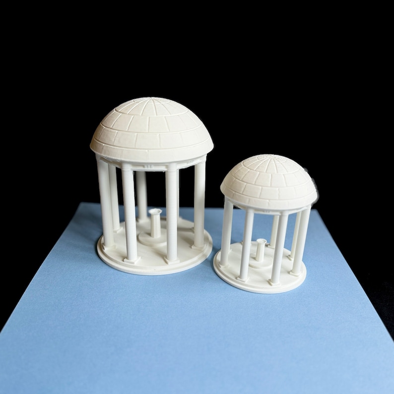 The UNC Old Well figurines, shown in two sizes.