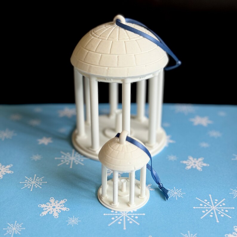 The larger and smaller UNC Old Well ornaments.