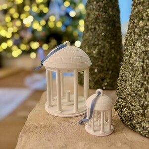 The large and small UNC old well ornaments, shown in a home decorated for Christmas.