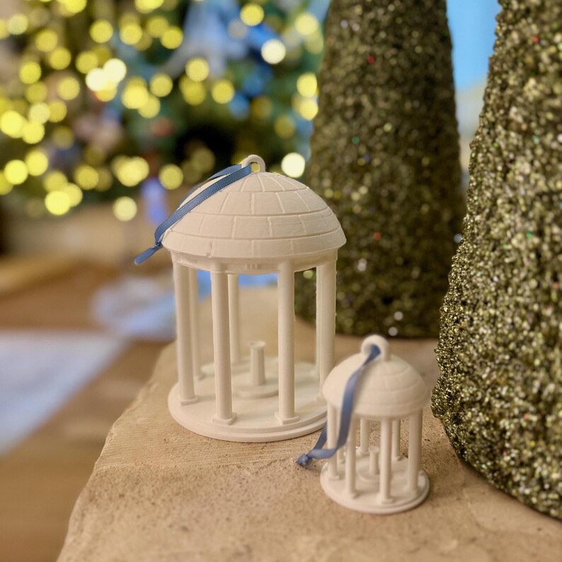 The large and small UNC old well ornaments, shown in a home decorated for Christmas.
