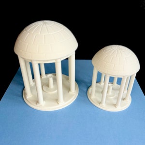 The large and small Old Well figurines, shown side by side.