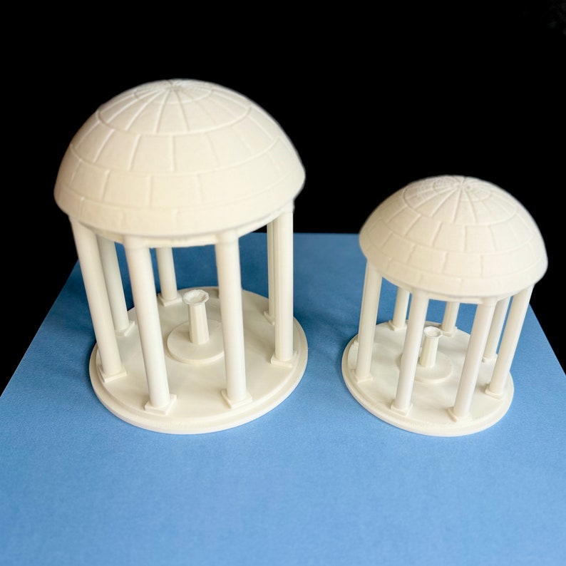 The large and small Old Well figurines, shown side by side.