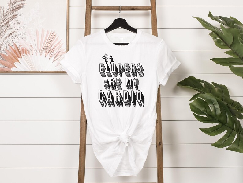 May include: White t-shirt with black text that reads "ElopErs Are My CaRdIo" in a 3D style font. The text is centered on the shirt.