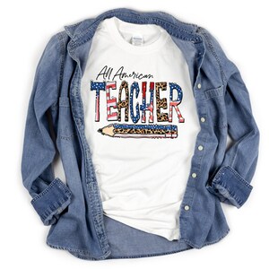 May include: White t-shirt with the text "All American TEACHER" in red, white, and blue with a leopard print and a pencil graphic.