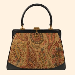 May include: A vintage handbag with a black handle and trim. The bag features a tapestry design in shades of gold, brown, and green. The clasp and hardware are gold-toned, adding a touch of elegance to this classic accessory.