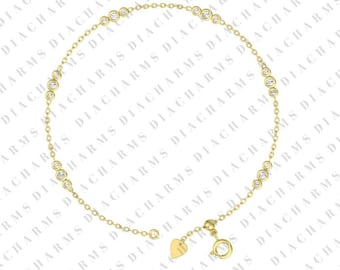 May include: A delicate gold chain bracelet with a heart charm and small round clear stones.