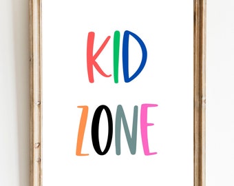 May include: A framed print with the words "KID ZONE" in colorful, handwritten letters. The letters are in shades of red, green, blue, orange, black, gray, and pink.