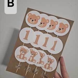 12 pack of Circle shaped bear cupcake toppers. brown and white colours. Number 1, bear head and bear body.