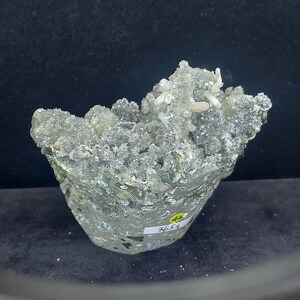Raw calcite crystal cluster coated in green chalcedony druzy crystals