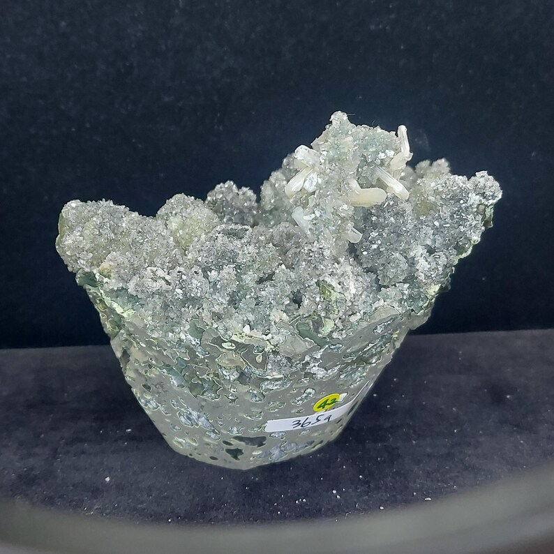 Raw calcite crystal cluster coated in green chalcedony druzy crystals