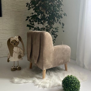 Brown children's armchair with ears and buttons