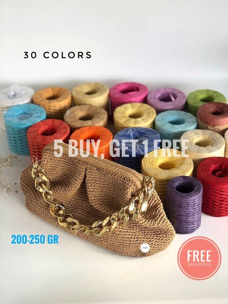 May include: A brown crocheted handbag with a gold chain strap. The bag is surrounded by 30 spools of colorful yarn, with the text "5 BUY, GET 1 FREE" and "FREE SHIPPING" visible.