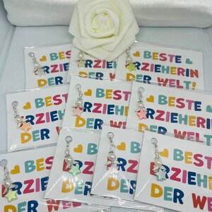 Pastellfarbener kleiner Schutzengel in Sternform für die Beste Erzieherin der Welt  mit Karte & Tüte