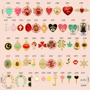 May include: A collection of gold-toned charms with various designs, including hearts, crosses, owls, and keys. Some charms feature colorful enamel accents and the text "SOLD OUT". Measurements are provided in millimeters and inches.