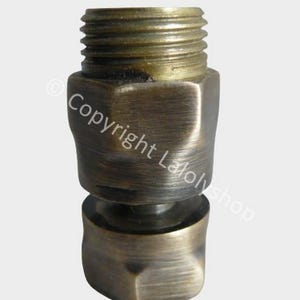 May include: A brass swivel adapter fitting with a threaded end. The adapter has a brushed finish and is designed for plumbing applications.