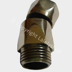 May include: A brass swivel connector with a threaded end. The connector is designed to connect two pipes at a 90-degree angle.
