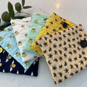 Book/e-reader sleeve. Handmade using cotton fabric, padded for extra protection & cotton lined