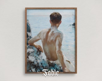 May include: A framed painting of a person sitting on a rock by the ocean. The person is facing away from the viewer and has their back to the camera. The ocean is a light blue color and the sky is a light blue color. The painting is framed in a light brown wood frame. The text "PRINT Fable CO." is printed at the bottom of the frame.