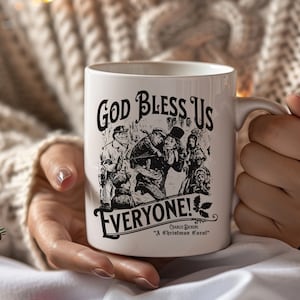 May include: White ceramic mug with a black and white illustration of characters from "A Christmas Carol" by Charles Dickens. The text "God Bless Us Everyone!" is printed on the mug.