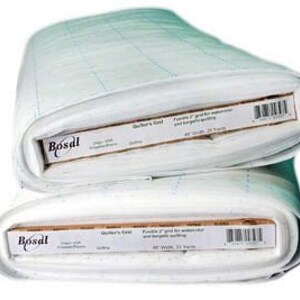 May include: Two rolls of white quilting fabric with a grid pattern. Each roll has a label that reads "Bosal" and includes text about the product's use for watercolor and serging quilting. The fabric is 48 inches wide and 25 yards long.