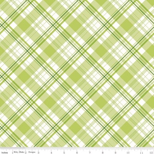 Puede incluir: Una tela con un patrón de cuadros diagonal en tonos verdes y blancos. El diseño presenta líneas que se cruzan creando una apariencia de cuadrícula. La tela se mide en pulgadas.