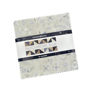 May include: A stack of 42 fabric squares, "Patchwork Blue" by Maywood Studio. The fabric has a light blue background with a floral pattern in shades of blue and white. The squares are held together with a band that displays the product name.