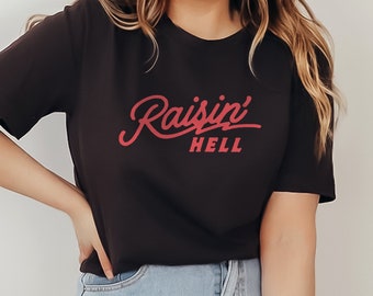 Raisin' Hell Graphic T-Shirt Black Funny & Humorous Southern Phrase and Saying Country Cowboy Retro Vintage Unisex Men's Women's Tee
