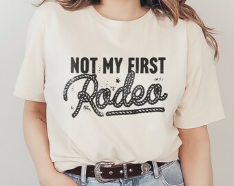Not My First Rodeo Graphic T-Shirt American Cowgirl & Cowboy Vintage Country Western Funny Humorous Phrase and Saying Type Unisex Tee