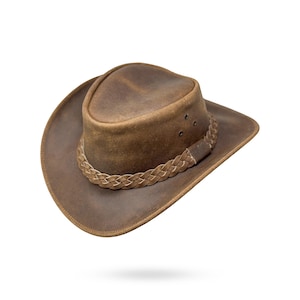 Könnte beinhalten: Ein brauner Cowboyhut aus Leder mit einem geflochtenen Lederband.