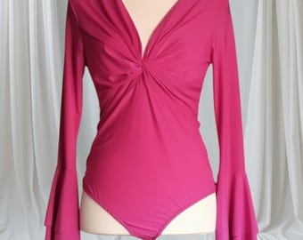Magnificent flamenco bodysuit with a crossover chest and ruffled sleeves. Bigamba color. New.