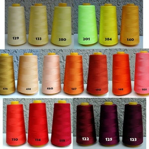 May include: A collection of 20 spools of thread in various colours, including yellow, orange, red, pink, and purple. Each spool is labelled with a number.