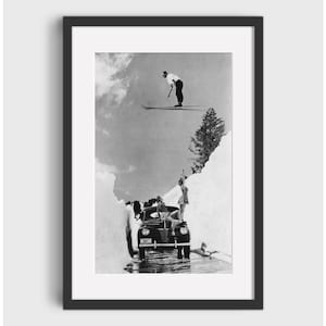 May include: A black and white photograph of a car stuck in a snowdrift. Two people are standing on the car, and a skier is jumping over a snowdrift in the background.