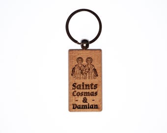 Llavero de madera maciza de los santos Cosme y Damián, grabado en EE. UU., católico.