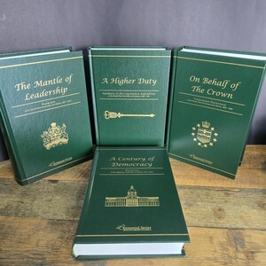 May include: A set of green hardback books with gold lettering. Titles include "The Mantle of Leadership", "A Higher Duty", "On Behalf of The Crown", and "A Century of Democracy". The books are part of the Centennial Series.