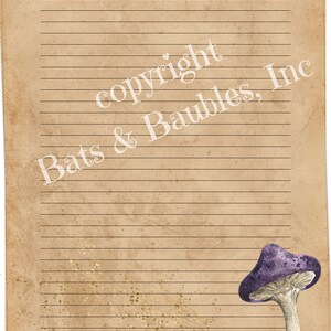 May include: A vintage-style lined paper sheet with a purple mushroom illustration and gold glitter accents. The text "copyright Bats & Baubles, Inc." is printed in white on the sheet.