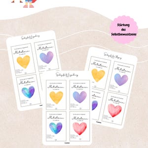 May include: Cards with watercolor heart designs in yellow, purple, blue, and red. The cards have text in German, including "Mut-mach-Stein" and "Stärkung des Selbstbewusstseins". The cards are designed for the "Eingewöhnung" or settling-in period.