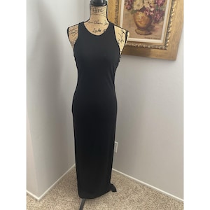black cross back high neck maxi dress Ribbed Plunged cross back maxi dress in black in a LENZING ECOVERO with luxurious satin finish Ariella | High Neck Black